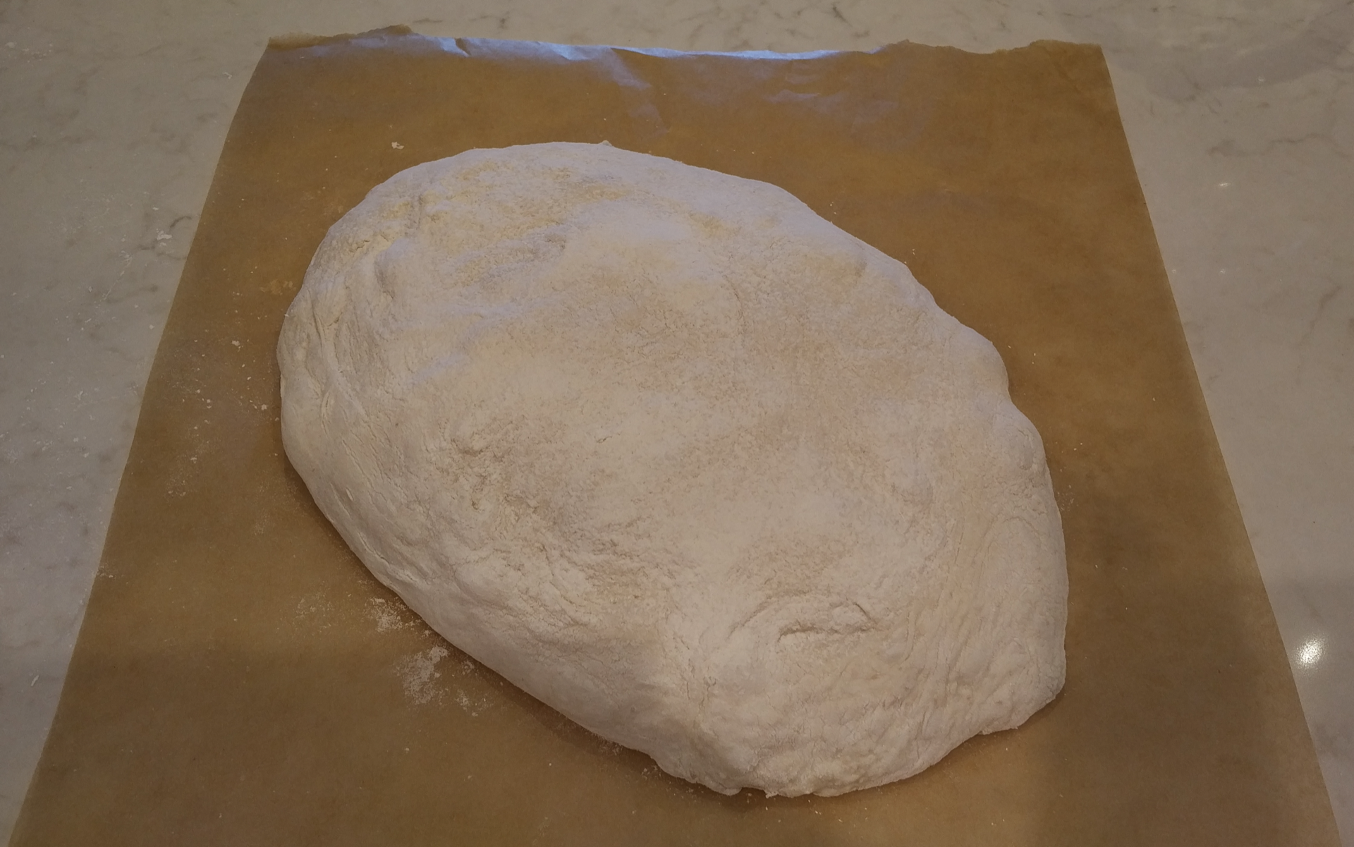 Folded dough on parchment